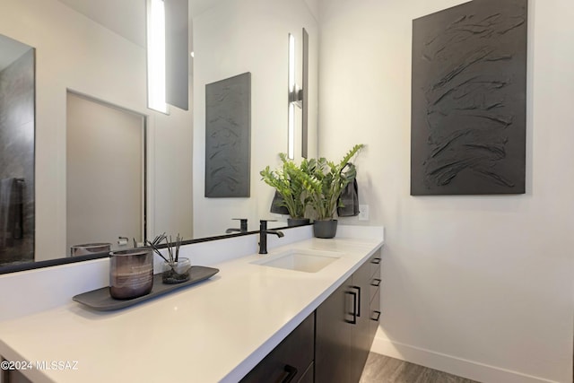 bathroom featuring vanity and hardwood / wood-style floors