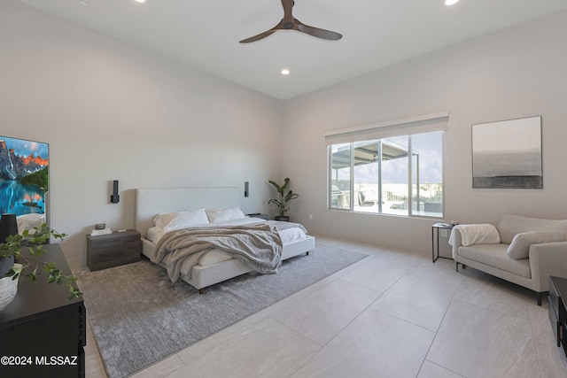 tiled bedroom featuring ceiling fan