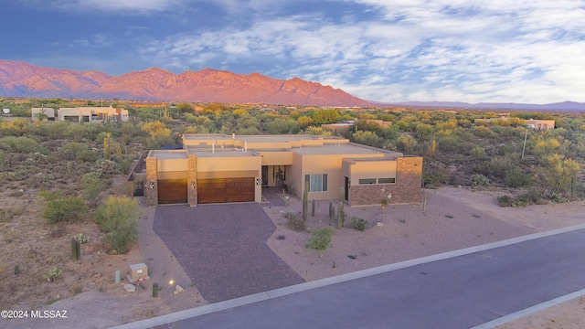 view of front of home featuring a mountain view and a garage