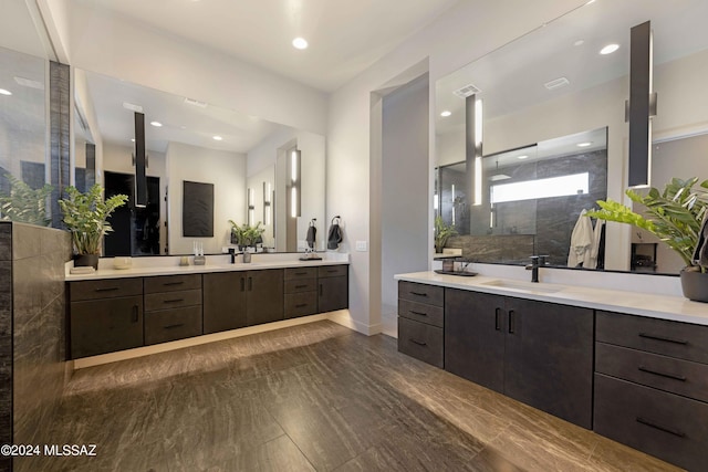 bathroom featuring vanity and a tile shower