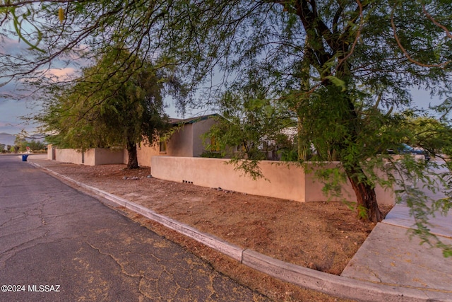 view of property exterior at dusk