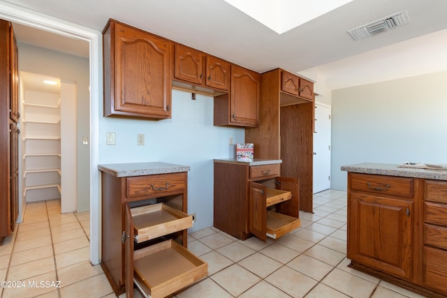 kitchen with light tile patterned floors