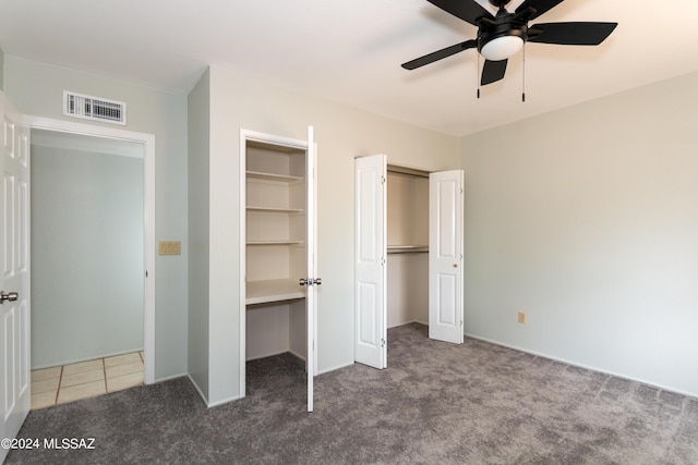 unfurnished bedroom with carpet floors and ceiling fan