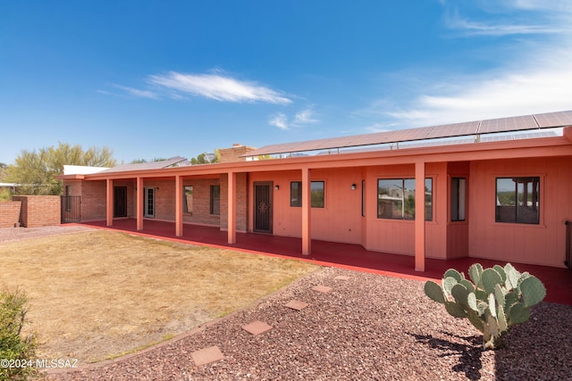 back of property featuring a patio area