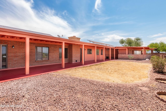 back of property featuring a patio