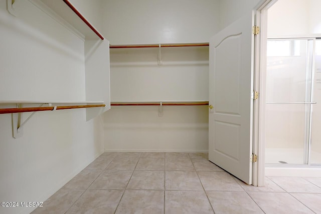 walk in closet featuring light tile patterned floors