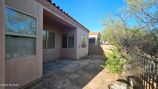 view of home's exterior with a patio area