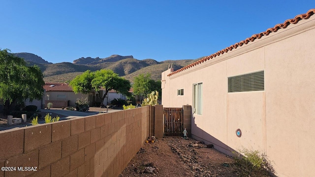 view of property exterior featuring a mountain view