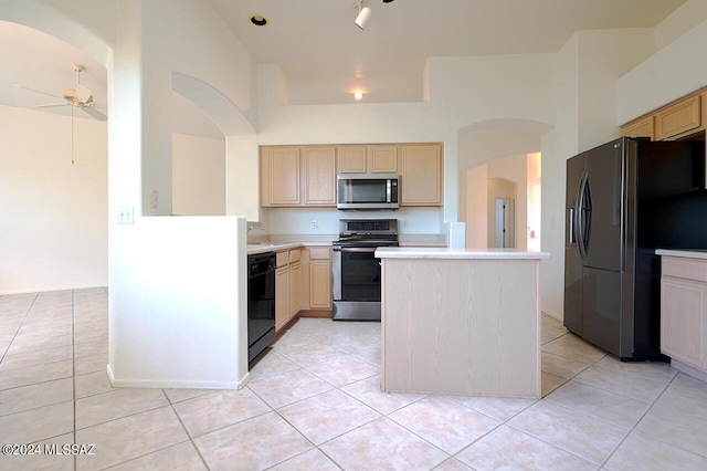 kitchen featuring black appliances, ceiling fan, light tile patterned floors, and light brown cabinets