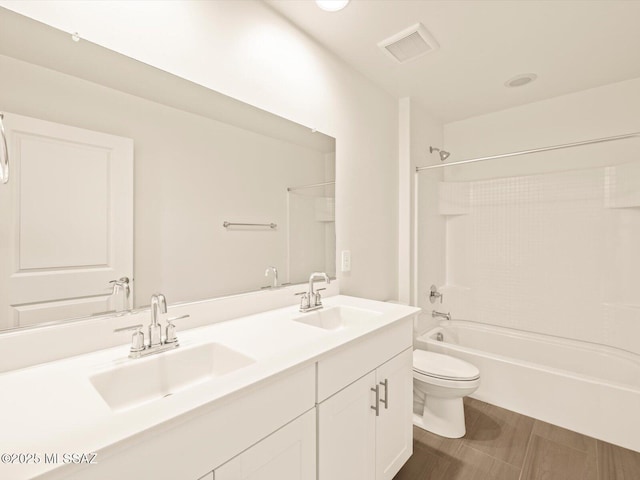 full bathroom with vanity, shower / bathtub combination, and toilet