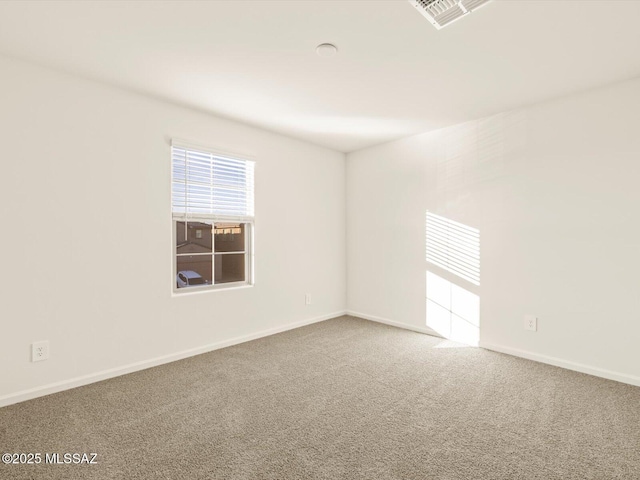 spare room featuring carpet flooring