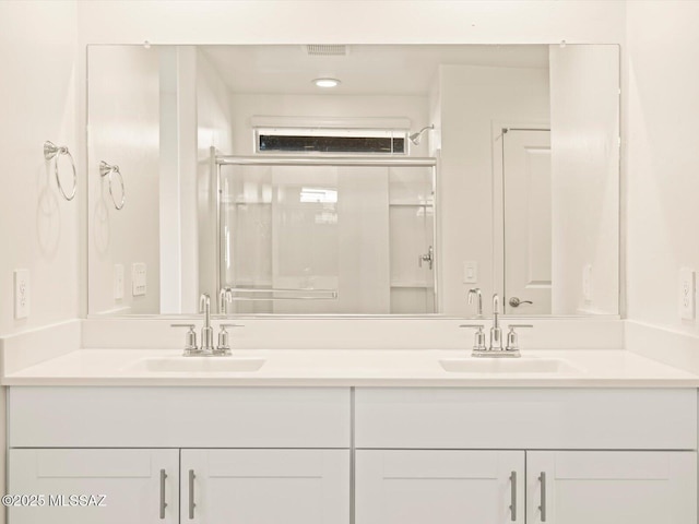 bathroom with vanity and walk in shower