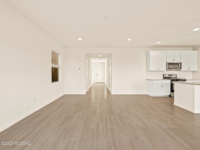 unfurnished living room featuring light hardwood / wood-style floors