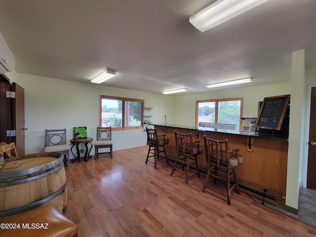 interior space with a healthy amount of sunlight and hardwood / wood-style floors