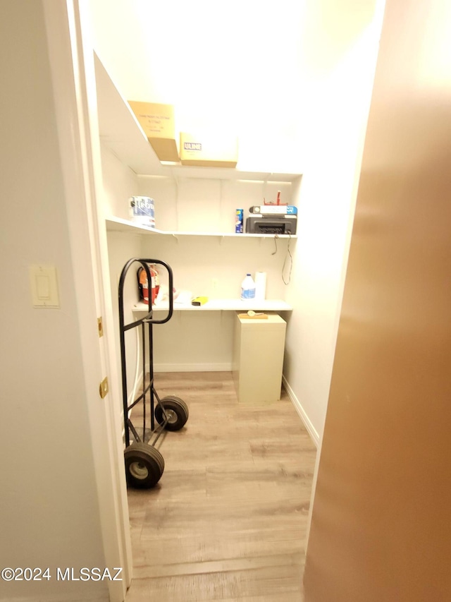 washroom with light wood-type flooring