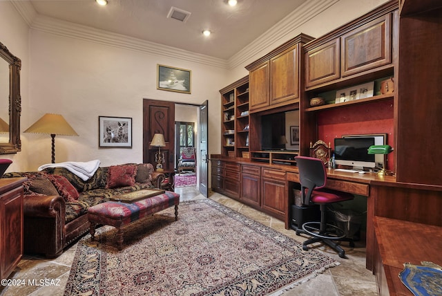 office space with built in shelves, crown molding, and built in desk