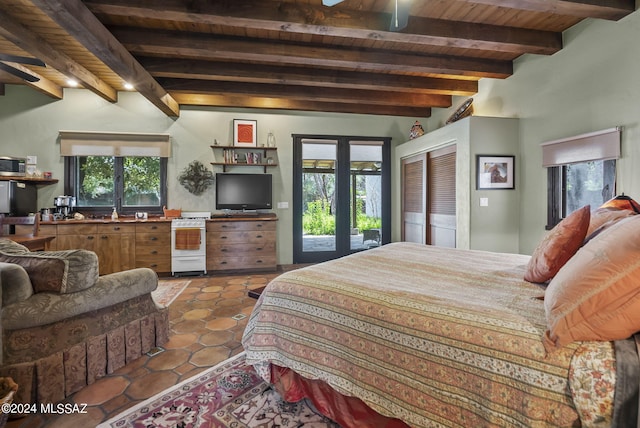 tiled bedroom with access to outside, multiple windows, beamed ceiling, and wood ceiling