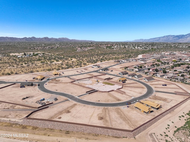 drone / aerial view featuring a mountain view