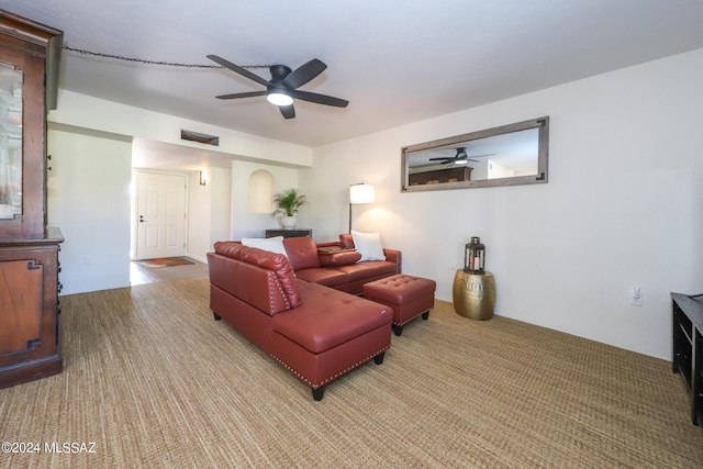 living room with ceiling fan and light carpet