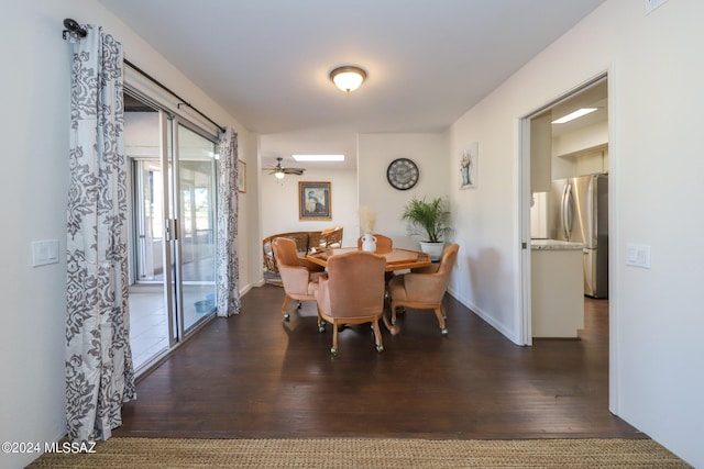 dining space featuring ceiling fan and dark wood-type flooring