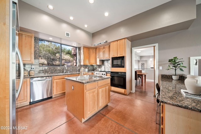 kitchen featuring dark stone counters, tasteful backsplash, a kitchen island, and black appliances