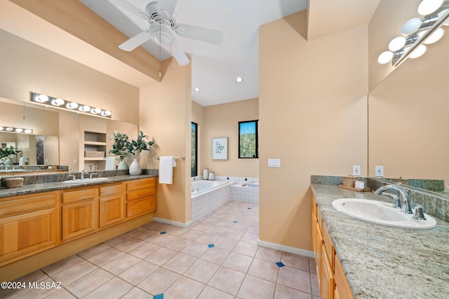 bathroom with vanity, tiled bath, tile patterned floors, and ceiling fan