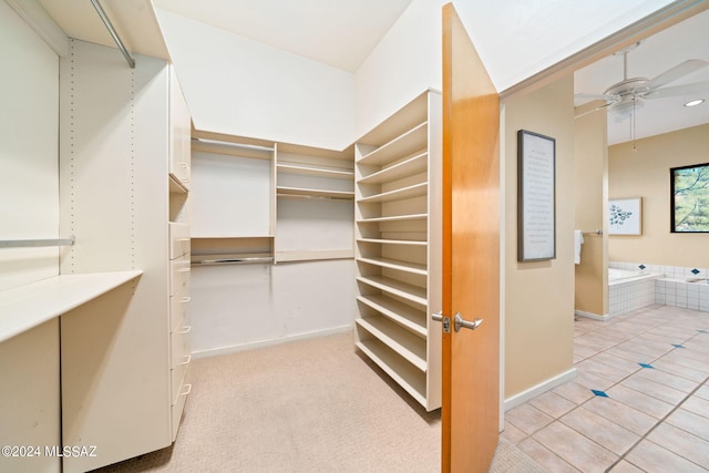 walk in closet featuring ceiling fan and light tile patterned floors