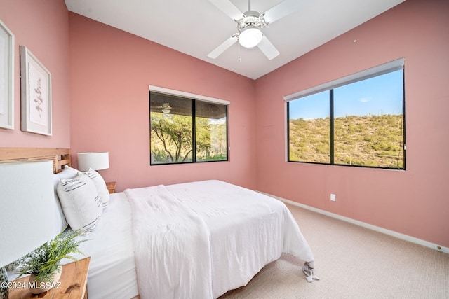 bedroom featuring ceiling fan and carpet