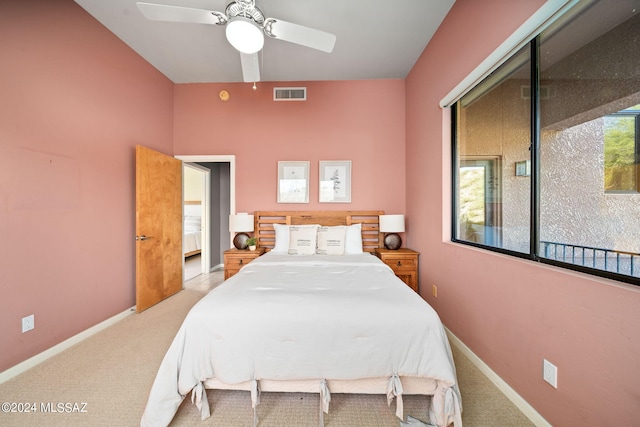 carpeted bedroom featuring ceiling fan and a closet