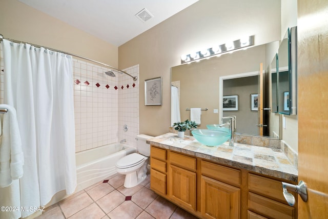 full bathroom featuring tile patterned flooring, vanity, shower / bath combination with curtain, and toilet