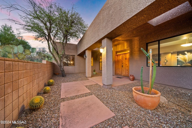 view of patio terrace at dusk