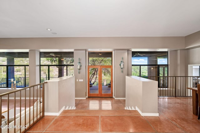 tiled entrance foyer featuring plenty of natural light and french doors