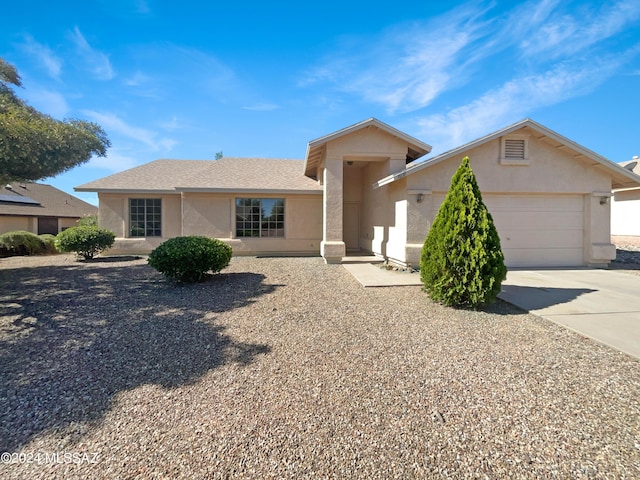 ranch-style house featuring a garage