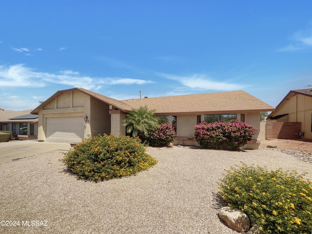 single story home with a garage