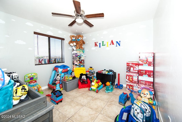 playroom with light tile patterned floors and ceiling fan