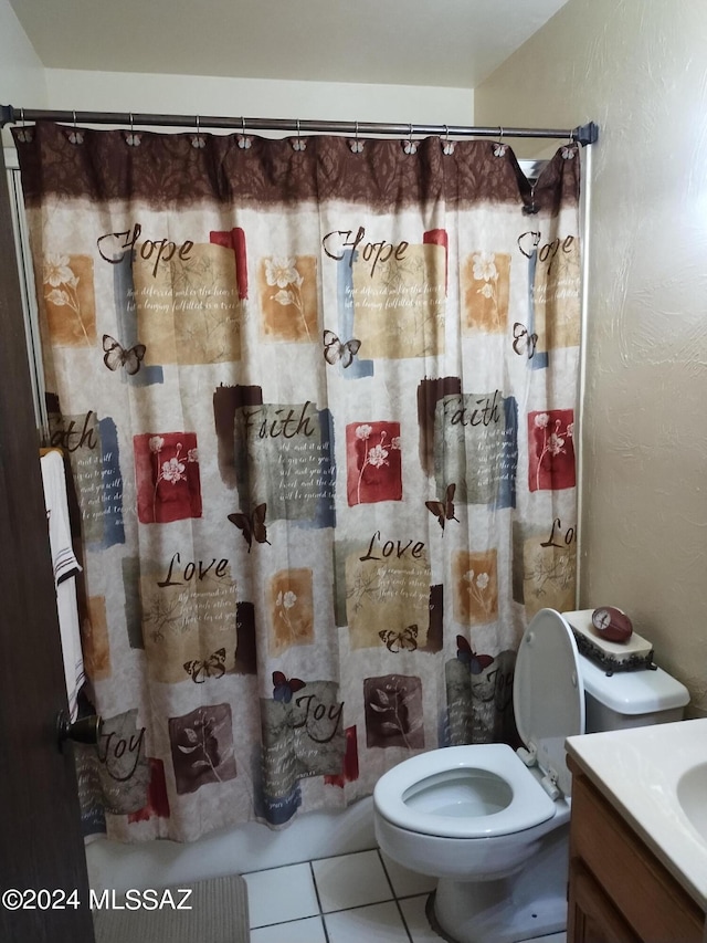 bathroom with toilet, vanity, tile patterned floors, and a shower with shower curtain