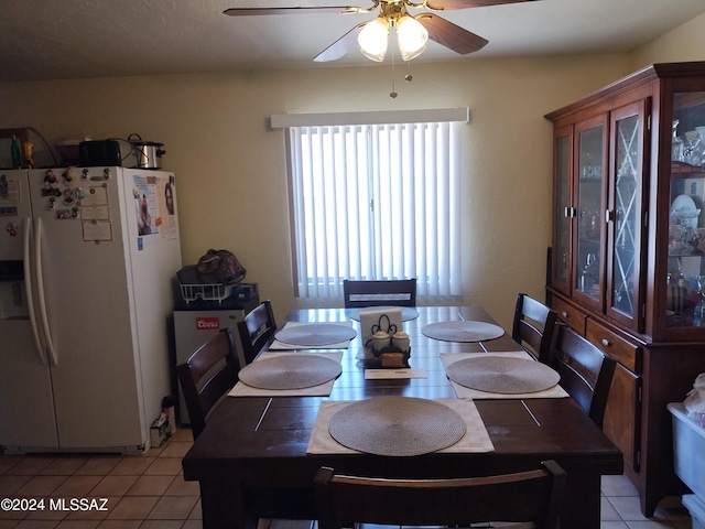 dining area with ceiling fan and light tile patterned floors