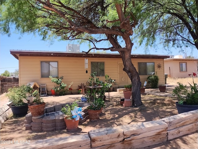 back of property with a patio