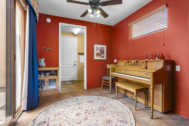 miscellaneous room featuring tile patterned floors and ceiling fan