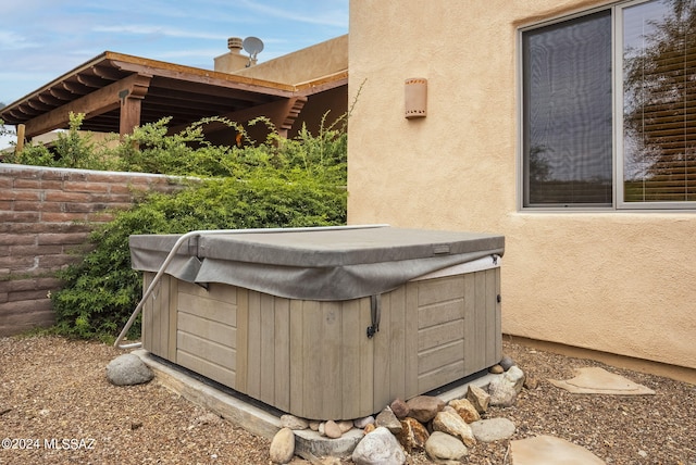 exterior space featuring a hot tub