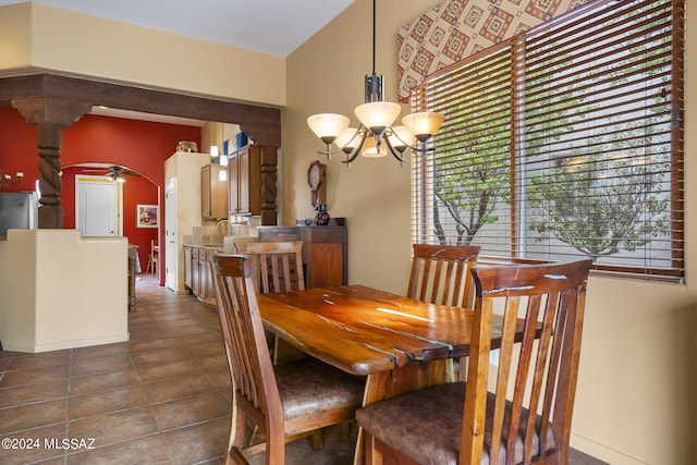 dining space with a chandelier