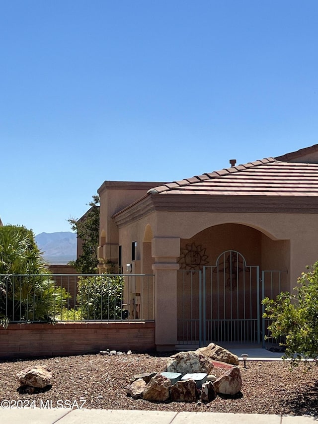 view of side of home featuring a mountain view