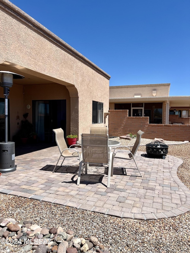 view of patio / terrace featuring a fire pit