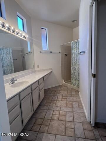 bathroom with vanity and a shower with curtain