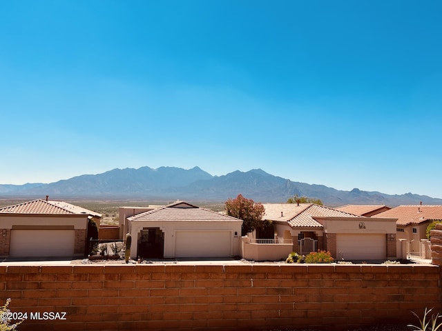 view of front of home featuring a mountain view and a garage