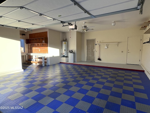 garage featuring a garage door opener and water heater