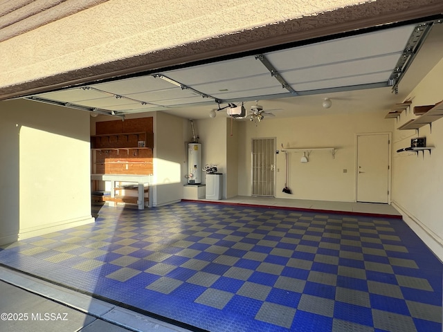 garage with a garage door opener and water heater