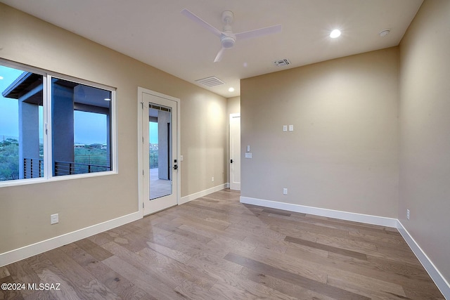 unfurnished room with ceiling fan and light hardwood / wood-style flooring