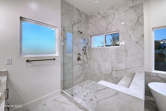 bathroom with shower with separate bathtub