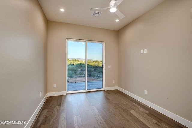 empty room with wood-type flooring and ceiling fan